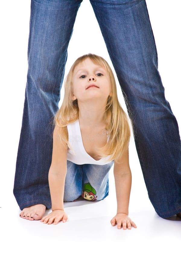 Little girl crawls between mom legs