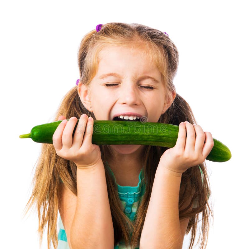 Little girl with cucumber. 