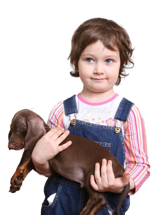 Little girl with dachshund puppy