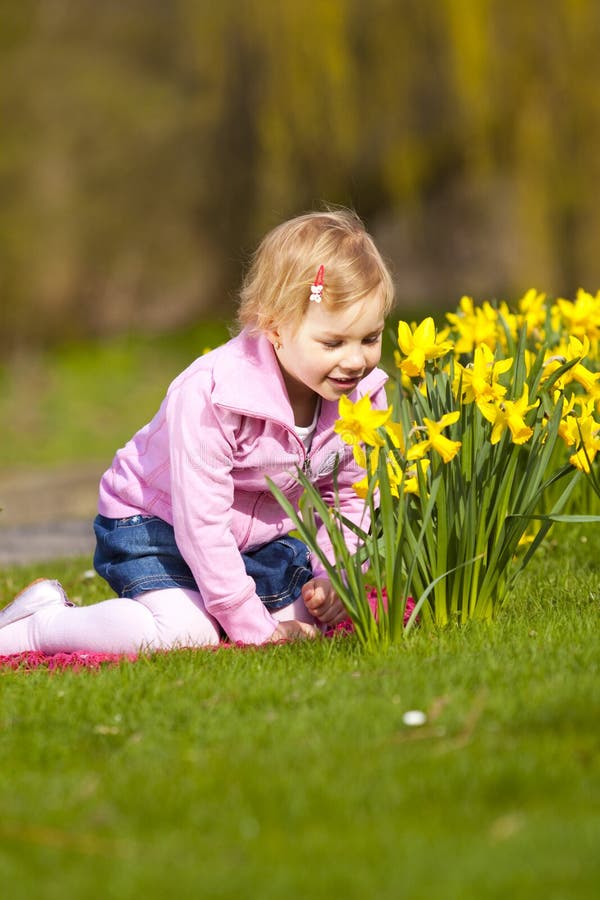 Little Girl and Daffodils in Park. Stock Image - Image of park ...