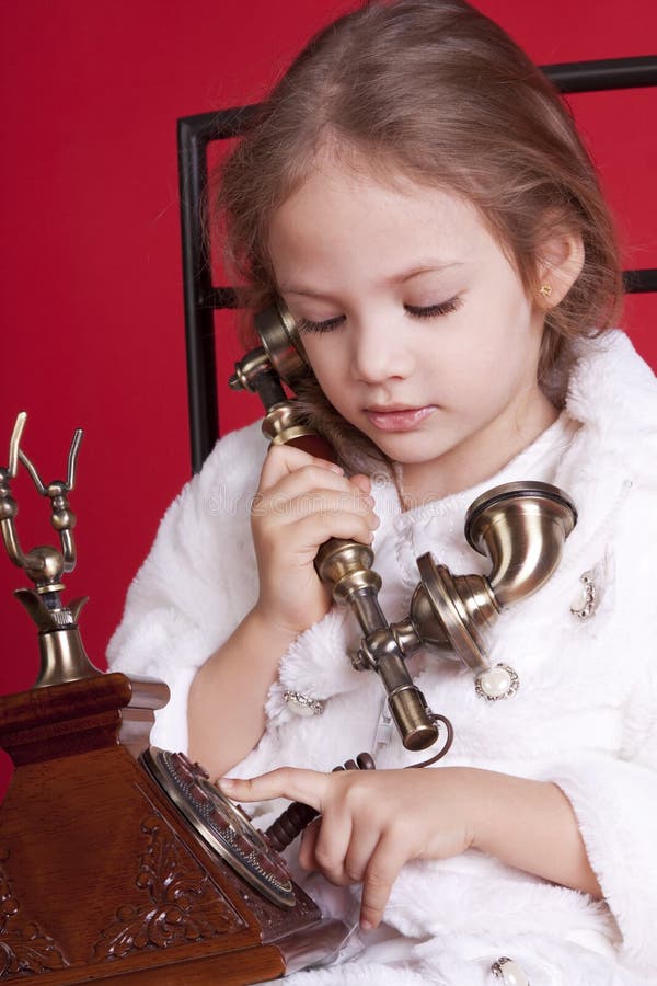 Little Girl Dails a Number on Phone Stock Image Image of adorable