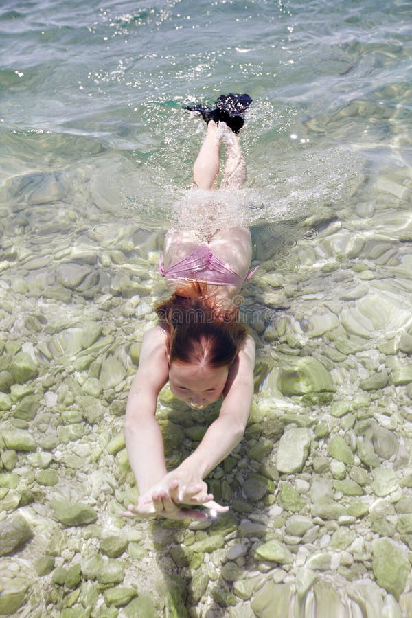 Little girl diving in sea