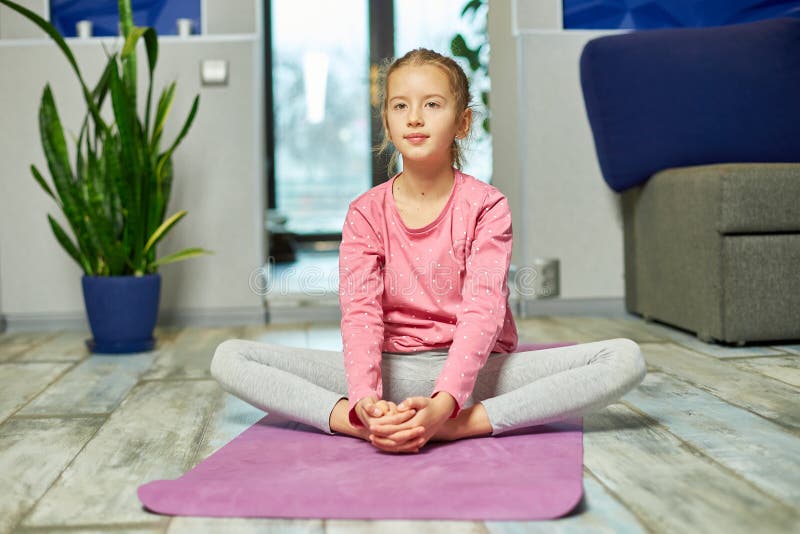Little Girl Doing Stretching Exercises, Practicing Yoga on Fitness Mat ...