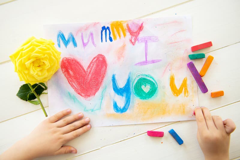 Little Girl is Drawing Postcard for Mothers Day stock photography Little Girl is Drawing Postcard for Mothers Day stock photography