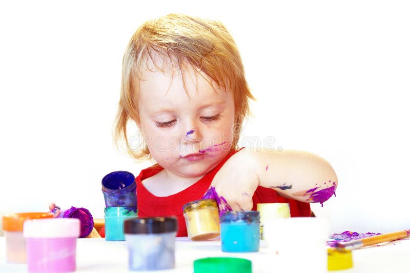 Little girl draws on white