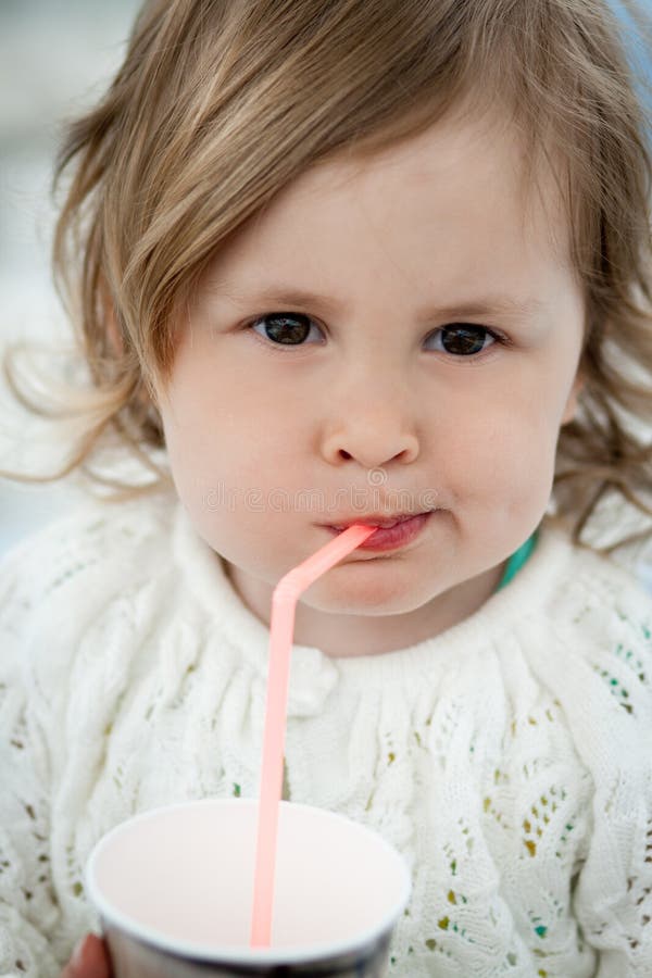 Little girl drinking stock image. Image of leisure, child - 70139111