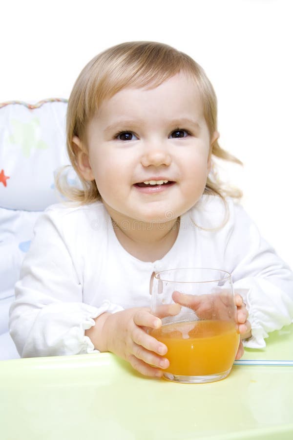 Little girl drinking juice stock image. Image of breakfast 11775999