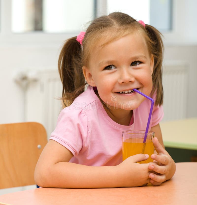 Little Girl is Drinking Orange Juice Stock Photo Image of female, hold 21367380