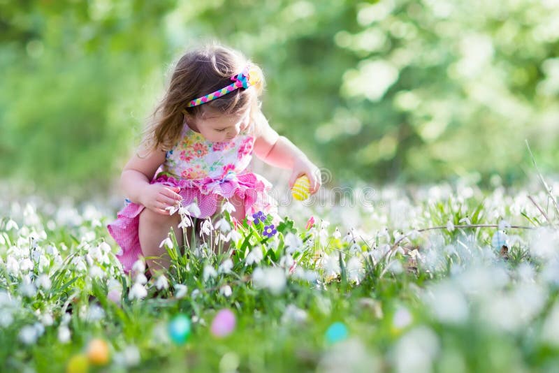 Little girl on Easter egg hunt