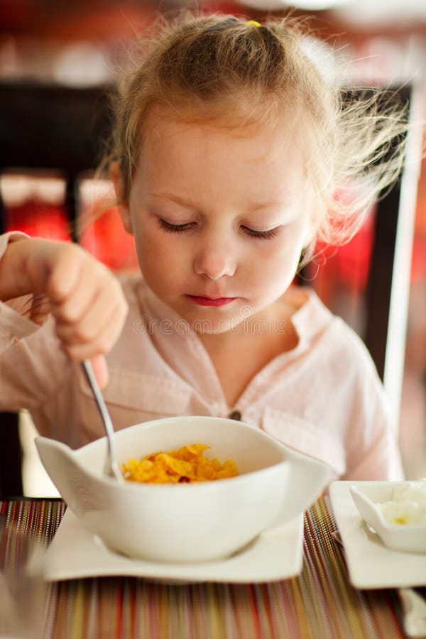 Little girl eating breakfast