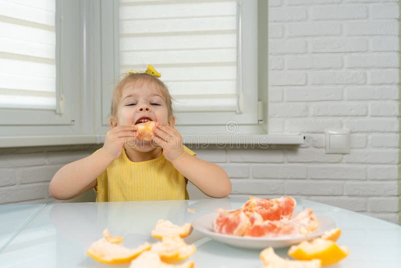 Little Girl Eating Grapefruit Stock Image Image of likes, islands