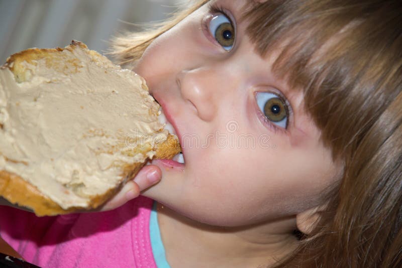 Little Girl Eating Loaf of Bread with Pate Stock Image Image of