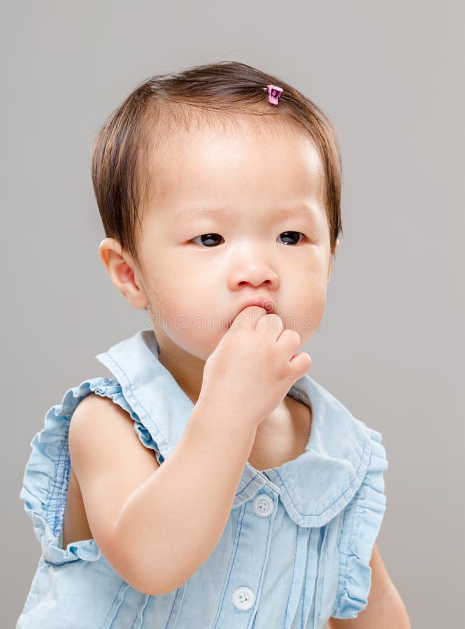 Little girl eating snack stock photo. Image of background 40943870
