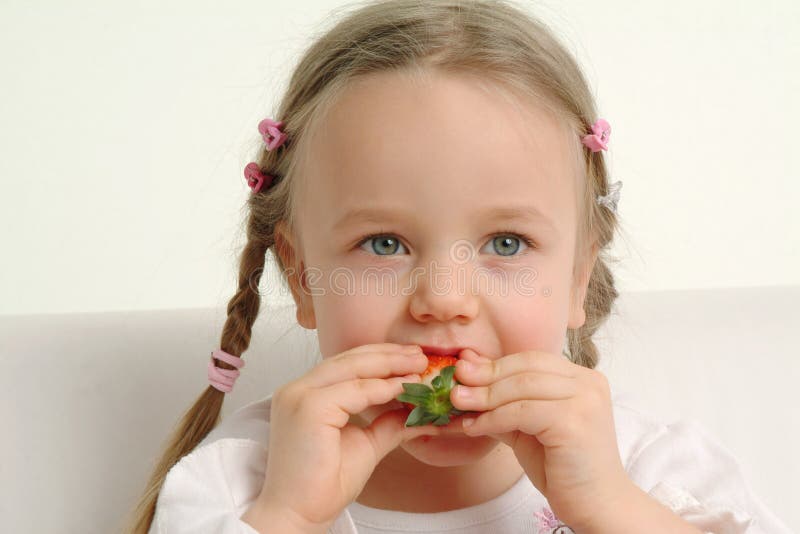 Little Girl Eating Strawberry Stock Image Image of enjoyment, person