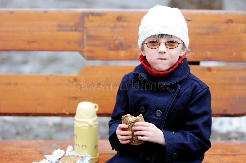 Little girl eats her lunch