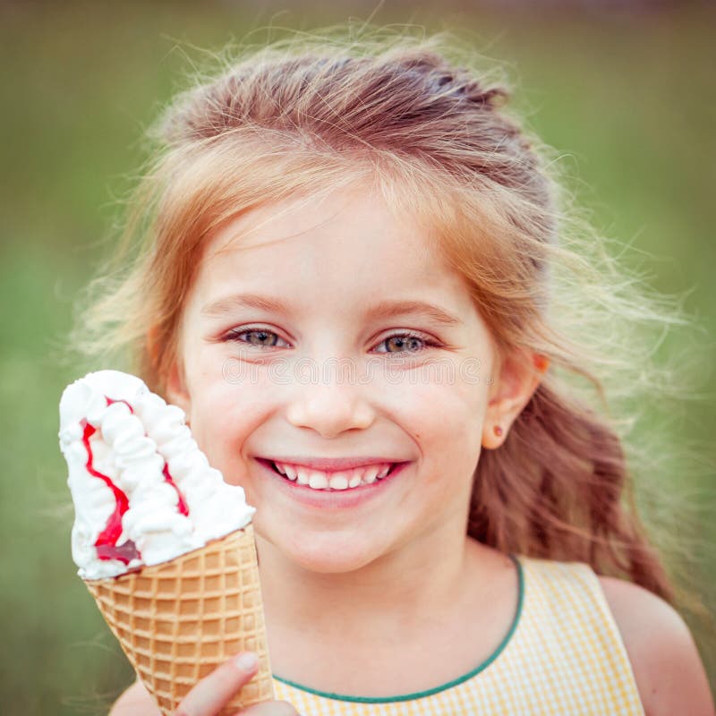 Little girl eats ice-cream