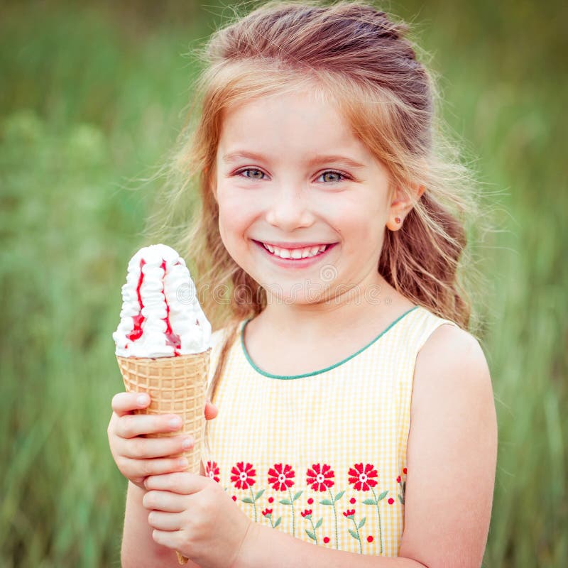 Little girl eats ice-cream