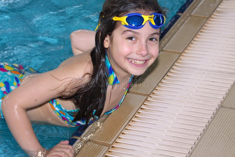 Little girl at edge of pool