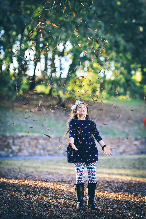 Little girl enjoying fall stock photo. Image of daughter 156269384