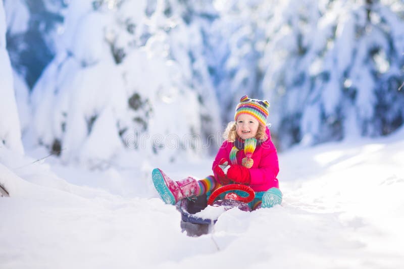 Little girl enjoying a sleigh ride. stock photos Little girl enjoying a sleigh ride. stock photos