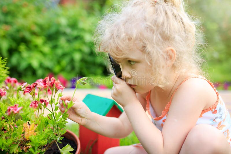 Little girl exploring nature stock photo