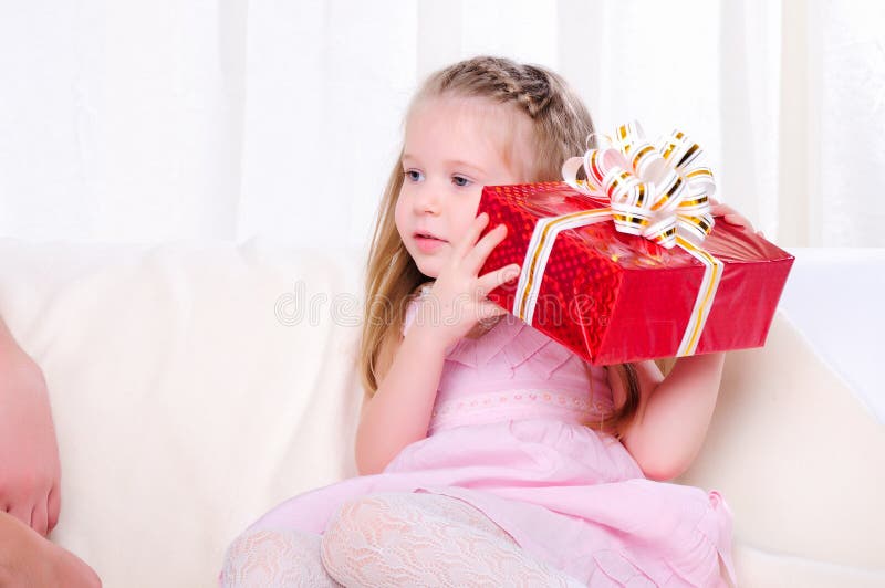 Little girl give a holiday gift