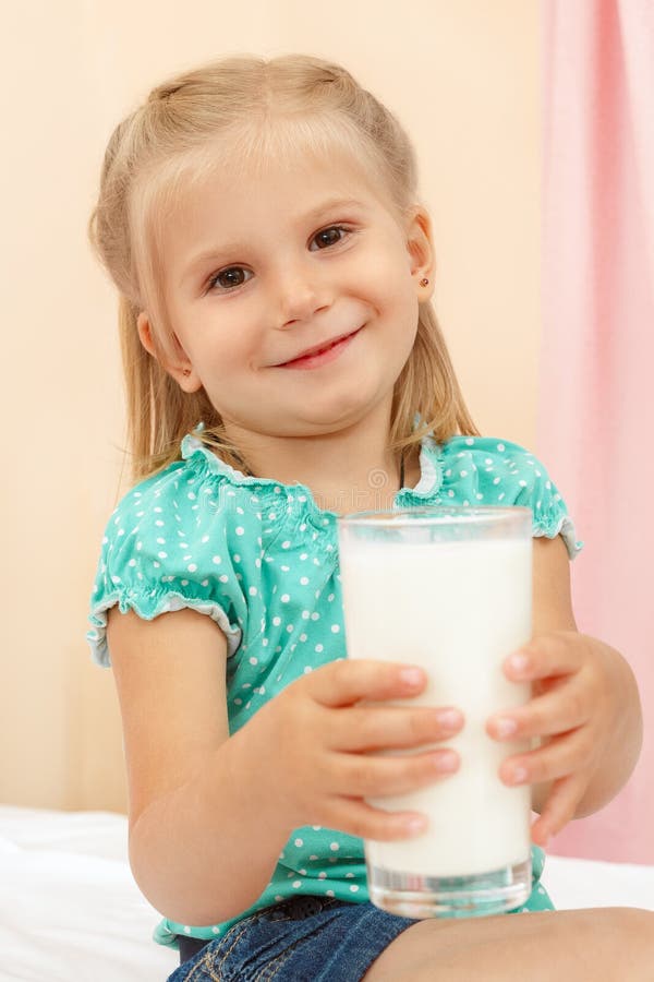 Little girl with glass of milk stock photography Little girl with glass of milk stock photography