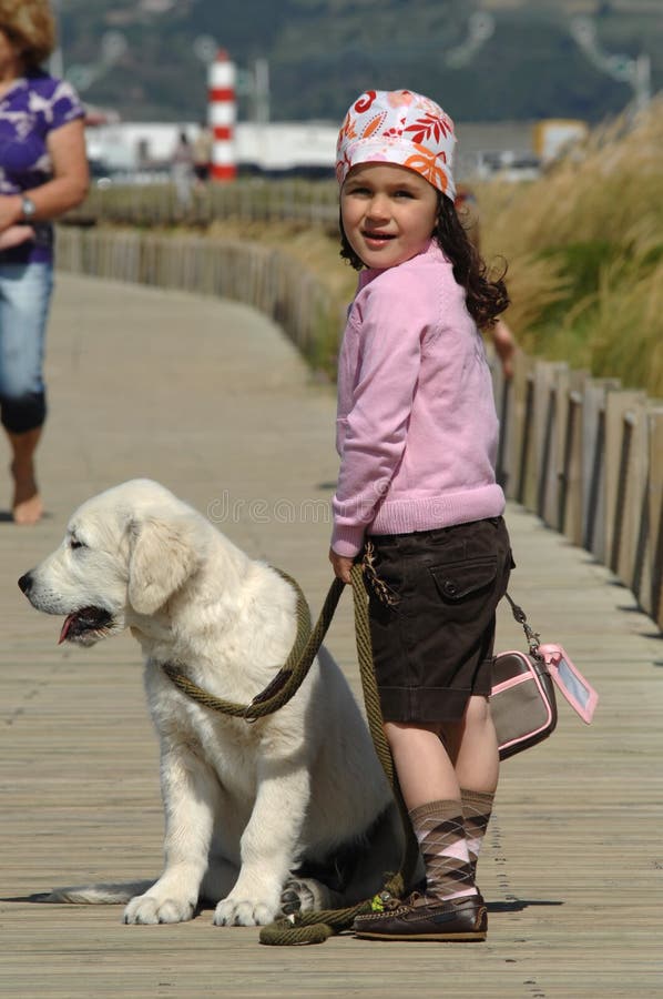 Little girl with a Golden retriever