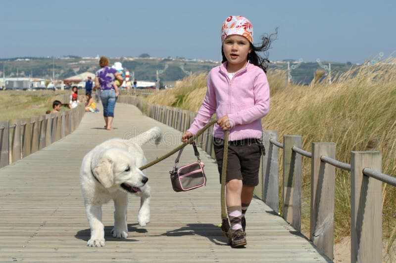 Little girl with a Golden retriever