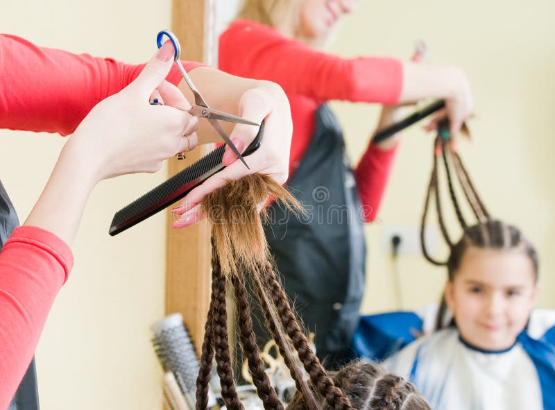 Little girl in hairdresser salon
