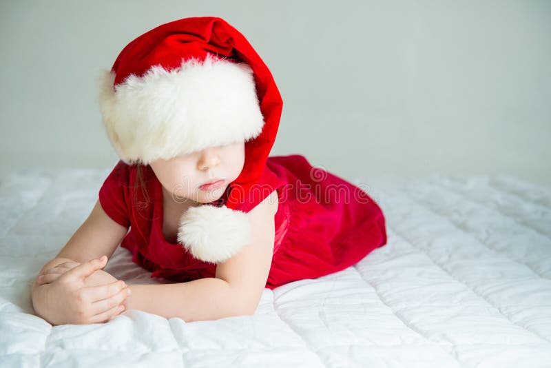 Little Girl in red Hat Santa