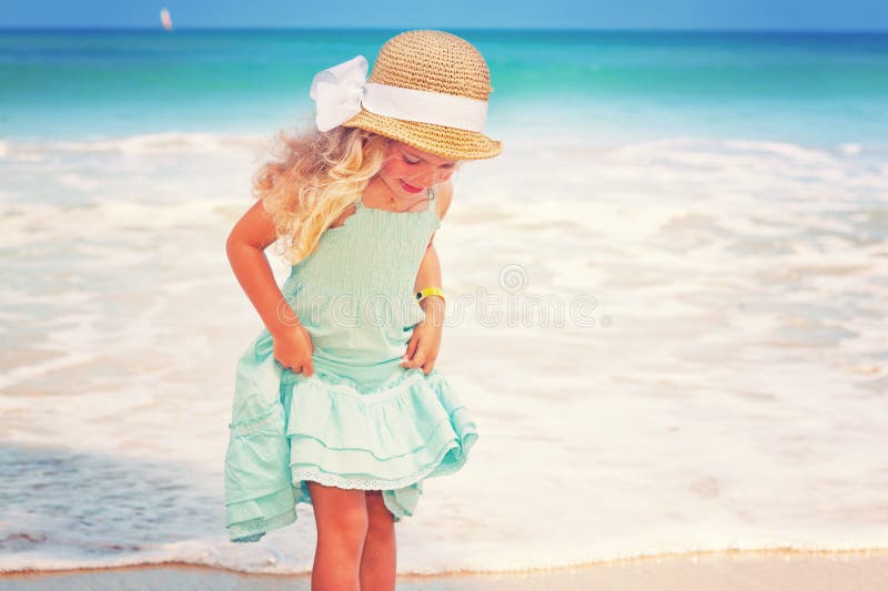 Little girl at tropical beach royalty free stock image