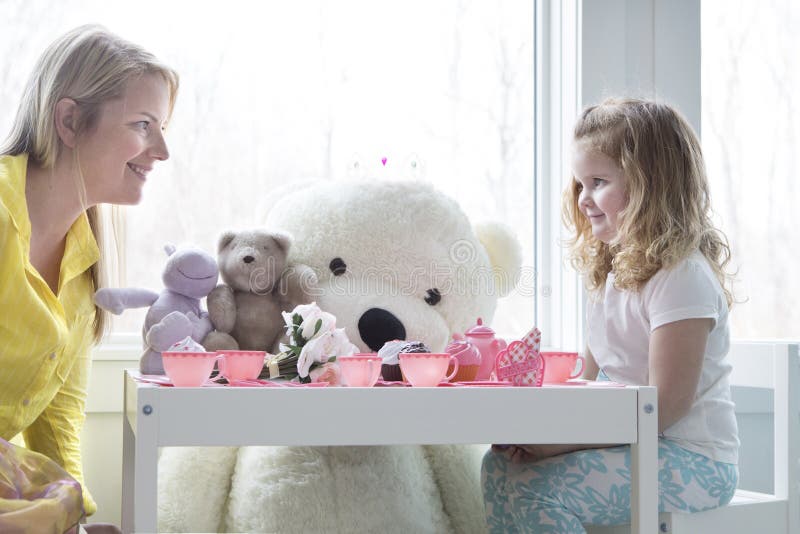 A mom and toddler daughter having a tea party. royalty free stock image A mom and toddler daughter having a tea party. royalty free stock image