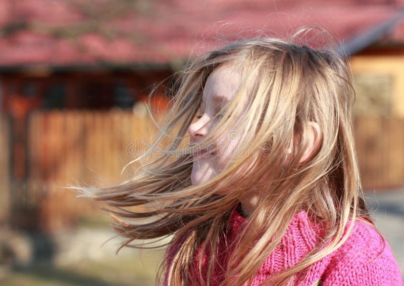 Little girl with hears flying in the wind