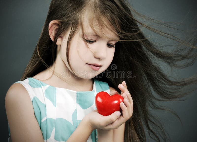 Little girl with a heart stock photography Little girl with a heart stock photography
