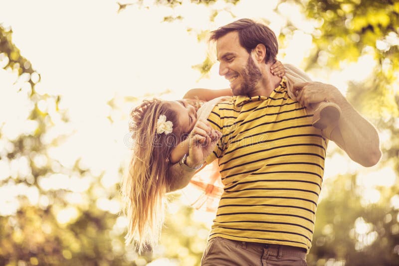 Little girl with her Daddy. Spring season. stock photography Little girl with her Daddy. Spring season. stock photography