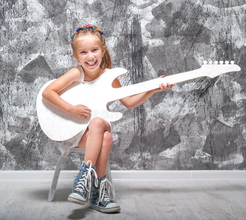 Little girl with her guitar