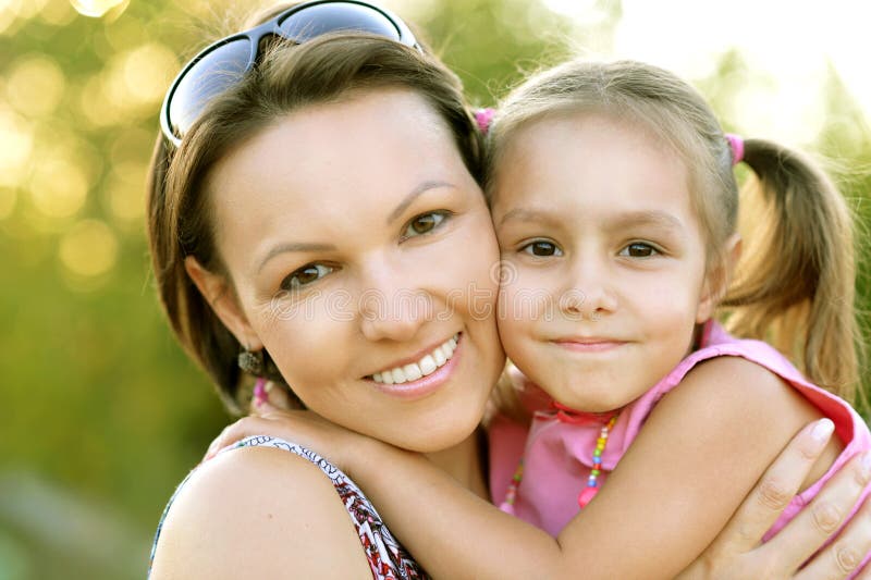 Little girl with her mother on a walk