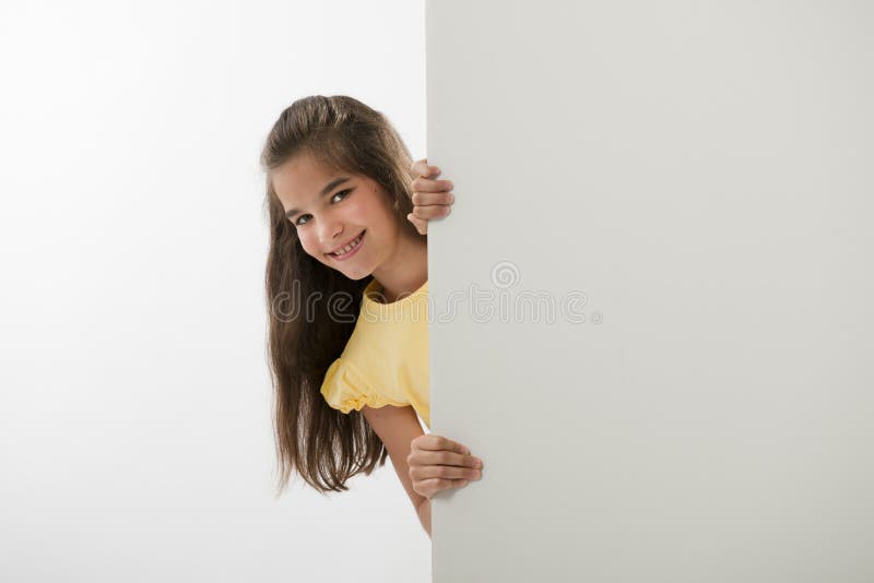 Little girl holding a blank sign