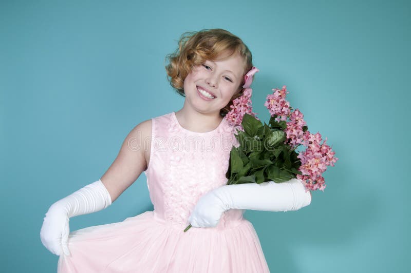 Little Girl Holding Bouquet of Flowers