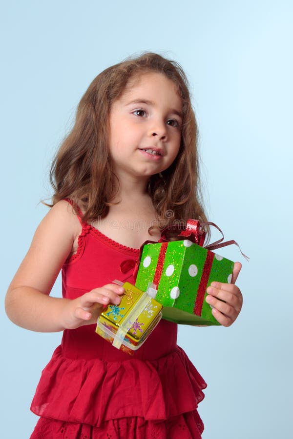 Little Girl Holding Christmas Presents Stock Photo Image of dress, ethnic 10373320