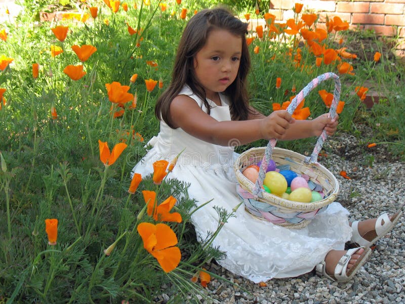 Little Girl Holding an Easter Basket Full of Easte Stock Image Image