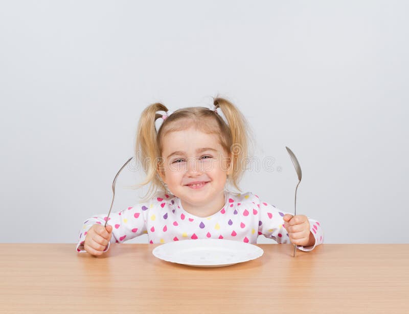 Little Girl Holding Fork And Spoon With Stock Image Image 69382993
