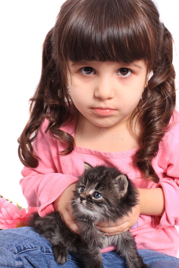 Little girl holding kitten stock photo. Image of cute 19096482