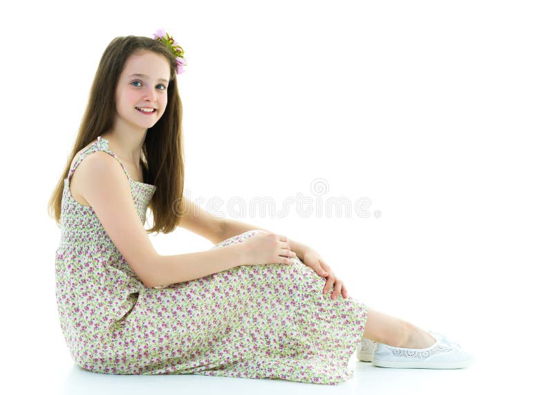 Little Girl Hugging Her Knees. Sitting on the Floor. Stock Photo ...