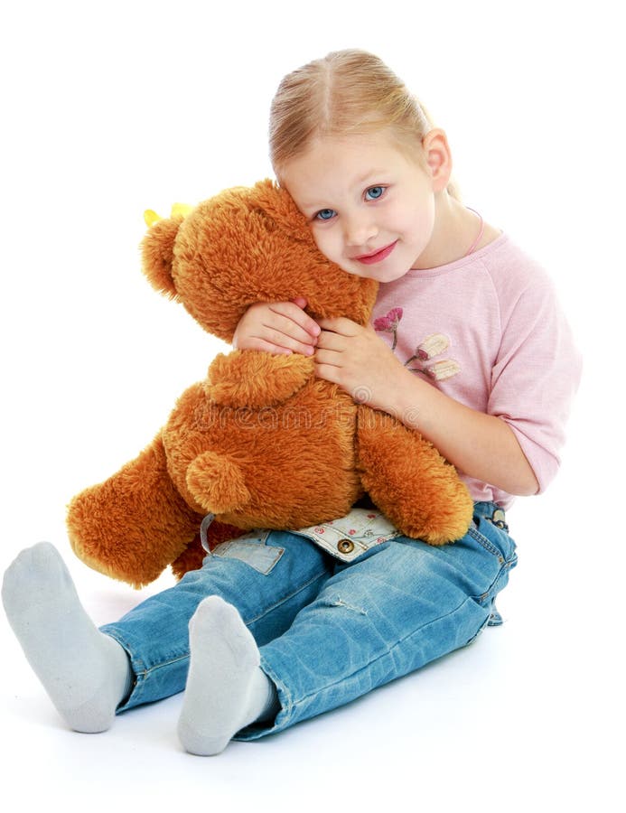 Little Girl Hugging a Teddy Bear. Stock Image - Image of bedding, child ...