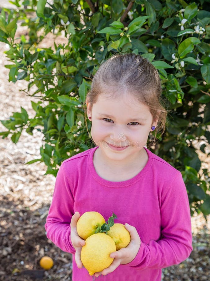 Little girl with lemon