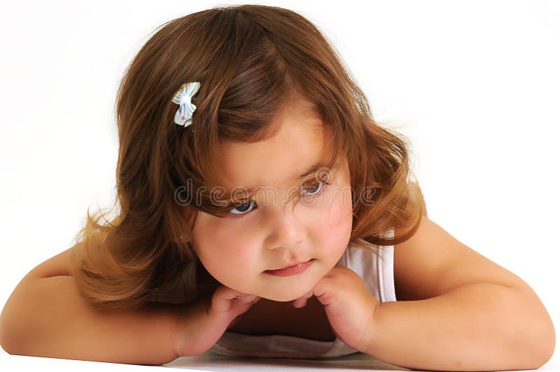 Little girl looking and smiling whilst leaning on