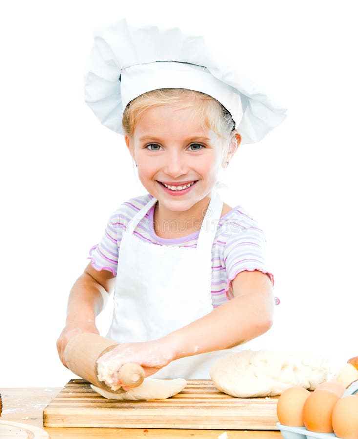 Little girl makes dough