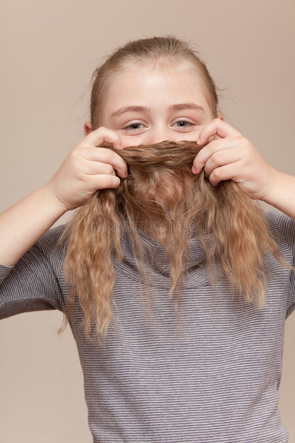Little Girl Making Moustache Her Hair Stock Photos Free & Royalty